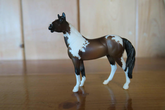 Standing Paint horse figure displayed as a traditional animal toy